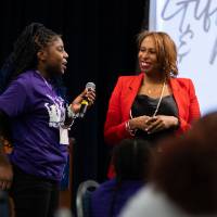 Girls of Color Summit previous event with a participant speaking with a speaker